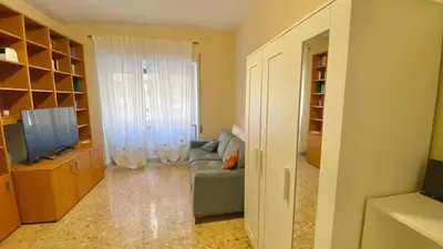 a living room with a couch and a television at Dimora Davide in Rome