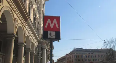 a sign on the side of a building on a street at Girasole Guesthouse in Rome