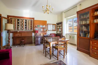 a living room with a table and chairs and a couch at Casa di Sofia in Rome