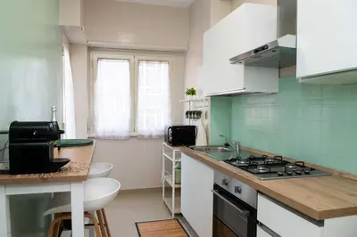 a kitchen with a sink and a stove top oven at Vatican sweet view in Rome