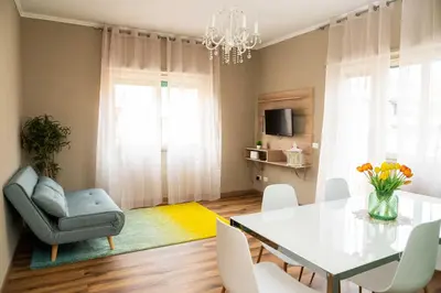 a dining room with a table and a chair at Vatican sweet view in Rome