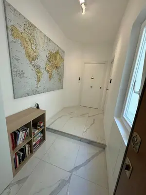 a room with a map of the world on the wall at Sunrise House - San Paolo in Rome
