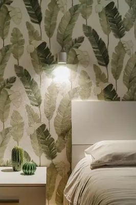 a bedroom with a green leafy wall mural at Suite 155 in Rome