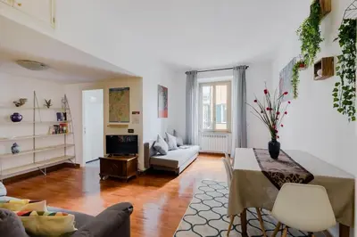a living room with a couch and a table at Casa Buonarroti, Rome, City Center, Elegant and Quiet Apartment in Rome