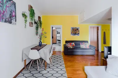 a living room with a table and a couch at Casa Buonarroti, Rome, City Center, Elegant and Quiet Apartment in Rome
