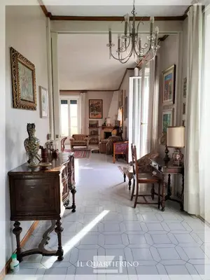 a living room filled with furniture and a chandelier at Il Quartierino in Rome