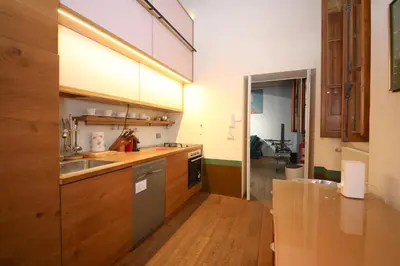 a kitchen with a sink and a stove at 500m from Piazza di Spagna - Canova Home by Hôtea in Rome