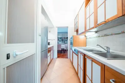 a kitchen with a sink and a counter top at Apartment in Rione Ludovisi in Rome