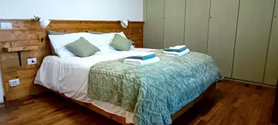 a bedroom with a bed with two towels on it at Nico's Apartment in Rome