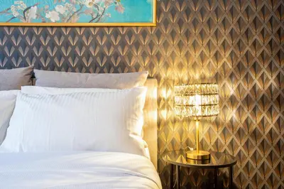a bedroom with a bed and a table with a chandelier at Confort Collection Trastevere in Rome
