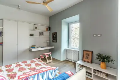 a bedroom with a bed and a window at 2 bedroom apartment Flaminio Vignola in Rome