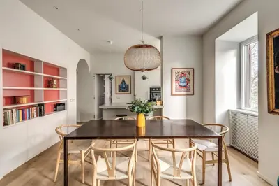 a dining room with a table and chairs at 2 bedroom apartment Flaminio Vignola in Rome