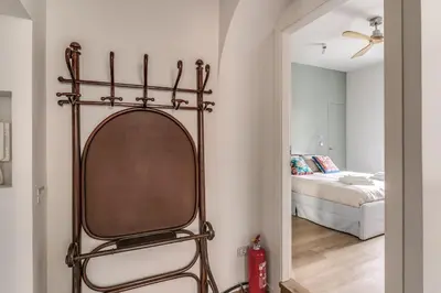 a mirror in a room with a bedroom at 2 bedroom apartment Flaminio Vignola in Rome