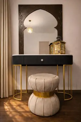 a dressing table with a stool in front of a mirror at RomAntic Dreams in Rome