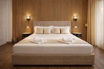 a bedroom with a large bed with two towels on it at RomAntic Dreams in Rome