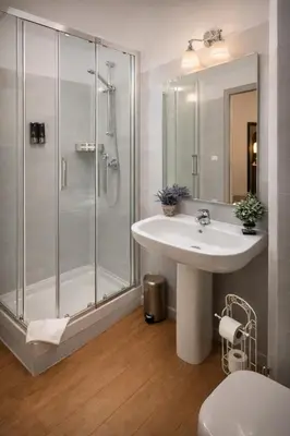 a bathroom with a sink and a shower at RomAntic Dreams in Rome
