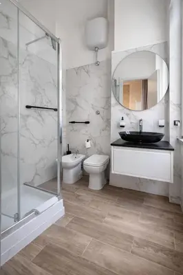 a bathroom with a sink toilet and a mirror at RomAntic Dreams in Rome
