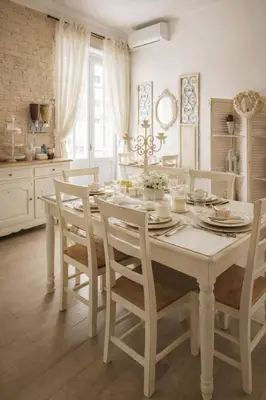 a white dining room with a white table and chairs at RomAntic Dreams in Rome