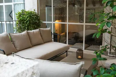 a living room with a couch and a fireplace at Historical Palace Apartment with Large Terrace in Rome