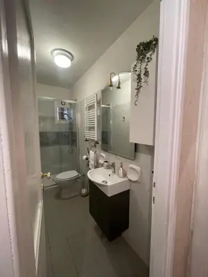 a bathroom with a sink and a toilet at Termini Station Turati House by Dama in Rome