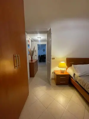 a bedroom with a bed and a lamp on a table at Termini Station Turati House by Dama in Rome