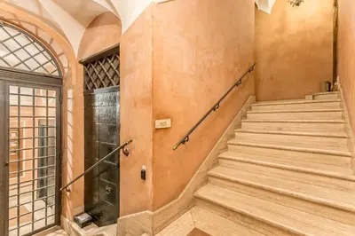 a set of stairs in a building with a window at Casa Iside in Rome