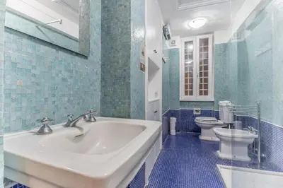 a bathroom with a sink and a toilet at Casa Iside in Rome