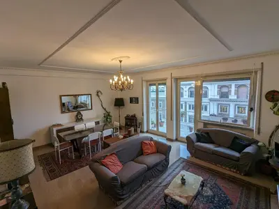 a living room with a couch and a table at Spacious Apartment in City Centre in Rome