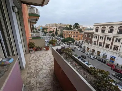 a balcony of a building with a view of a city at Spacious Apartment in City Centre in Rome