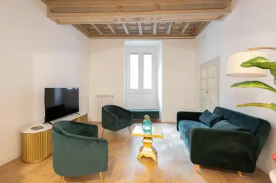 a living room with two couches and a tv at Modern and Bright Flat - Rome City Center in Rome