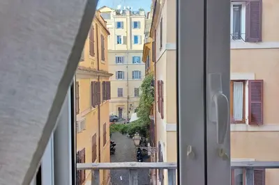 a view of a city street from a window at Colosseum Apartment Renovated Via Frangipane in Rome