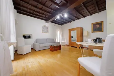 a living room with a couch and a table at Colosseum Apartment Renovated Via Frangipane in Rome