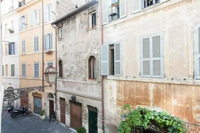 an alley in an old building with a street light at Cappellari Campo dei Fiori int 2 in Rome