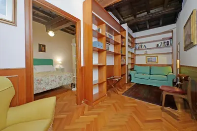 a room with a bed and a couch and a bedroom at Leutari in Rome