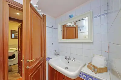 a bathroom with a sink and a mirror at Leutari in Rome