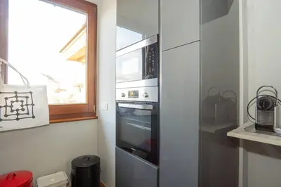 a kitchen with an oven and a window in it at Divine View Apartment in Rome