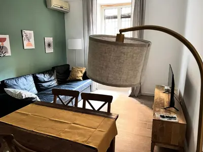 a living room with a couch and a table at La casa di Nina in Rome