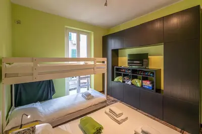 a bedroom with a bunk bed and a tv at La Eterna Dimora in Rome