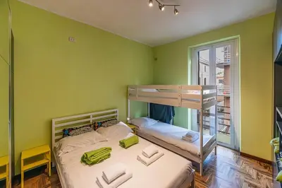a bedroom with two bunk beds and a window at La Eterna Dimora in Rome