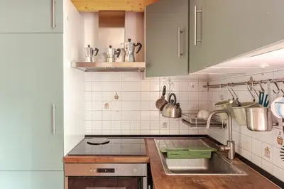 a kitchen with a sink and a counter top at Cozy studio at pedestrian street in Rome