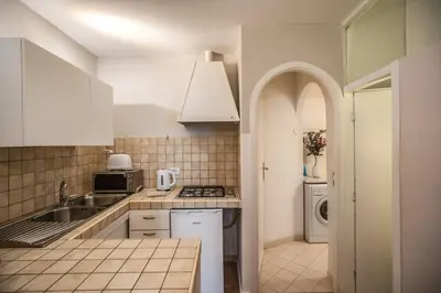 a kitchen with a sink and a stove top oven at Cappellari Campo dei Fiori int 3 in Rome