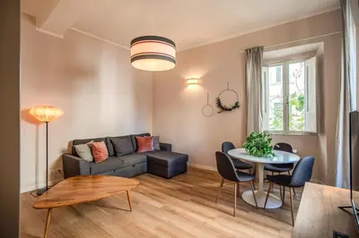 a living room with a couch and a table at Cappellari Campo dei Fiori int 3 in Rome