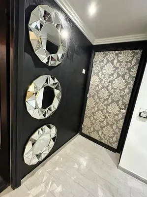 a room with two mirrors on the wall and a tile floor at lucky home in Trastevere in Rome