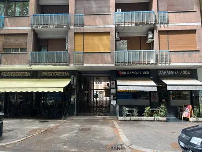 an empty parking lot in front of a building at lucky home in Trastevere in Rome