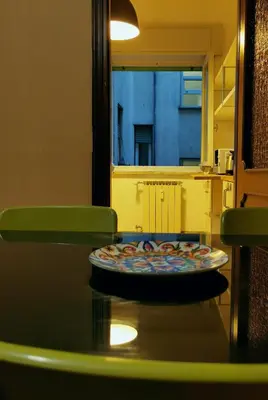 a table with a plate of food on top of it at Kea Alloggio Turistico in Rome