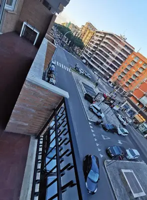 a view of a street with cars parked in a city at Kea Alloggio Turistico in Rome