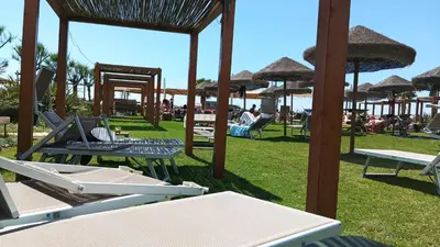 a group of lounge chairs and umbrellas at a beach at Kea Alloggio Turistico in Rome