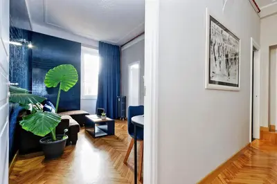 a living room with a couch and a potted plant at Vico Rooms and Terrace in Rome