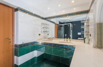 a bathroom with two sinks and two mirrors at Vaticano-Metro A, Penthouse with AC, Wi-Fi e Netflix in Rome