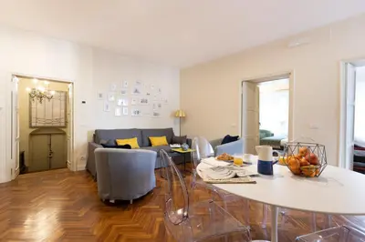 a living room with a table and a couch at Coppelle Charme in Rome